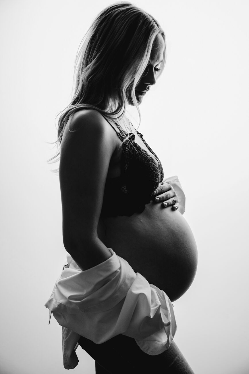 Backlit black and white maternity portrait with lace bralette, Boise maternity photographer