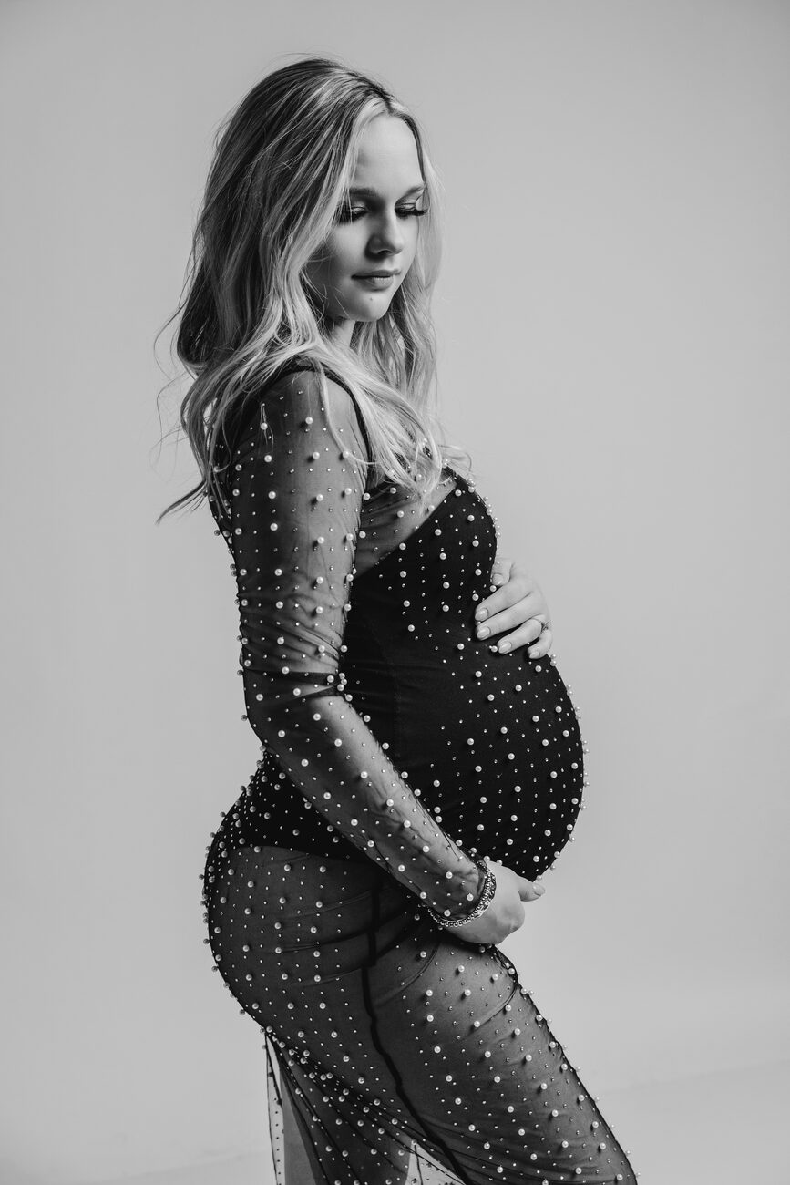 Expecting mother in pearl-beaded sheer gown, editorial Boise maternity photography