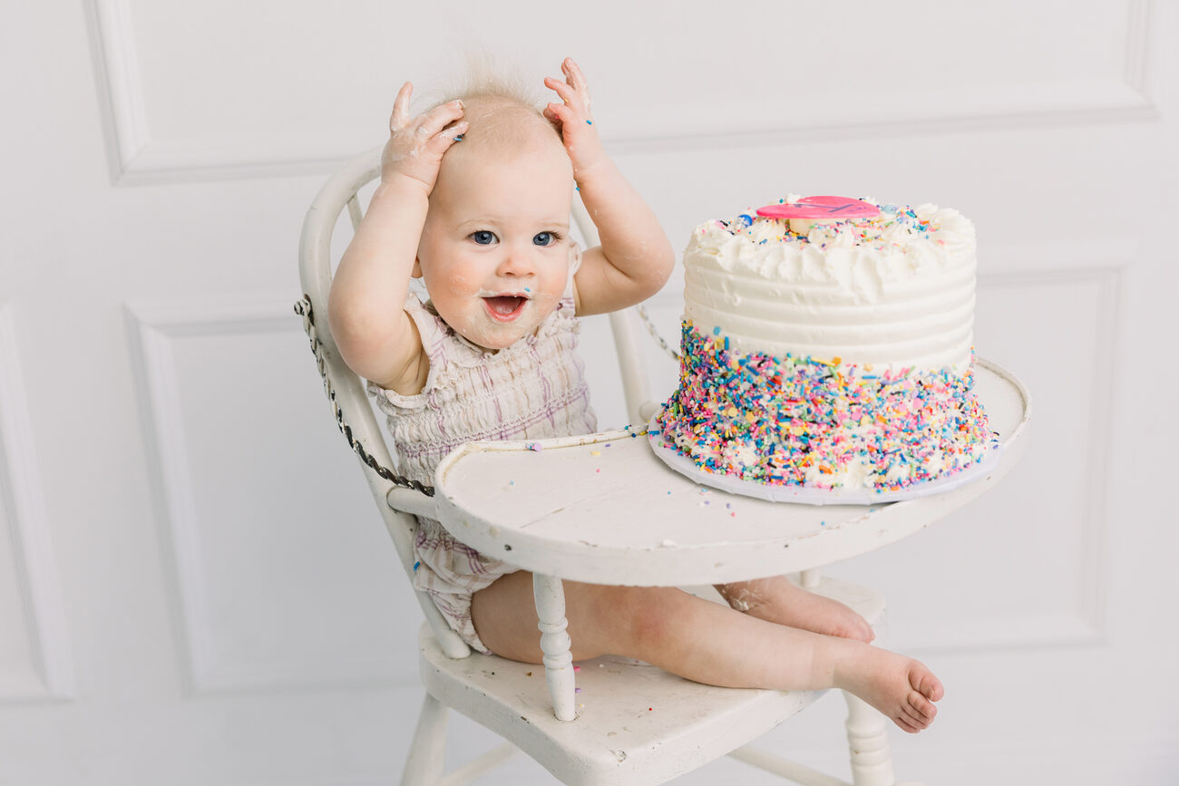 cake smash photography Boise, baby in high chair with sprinkle birthday cake